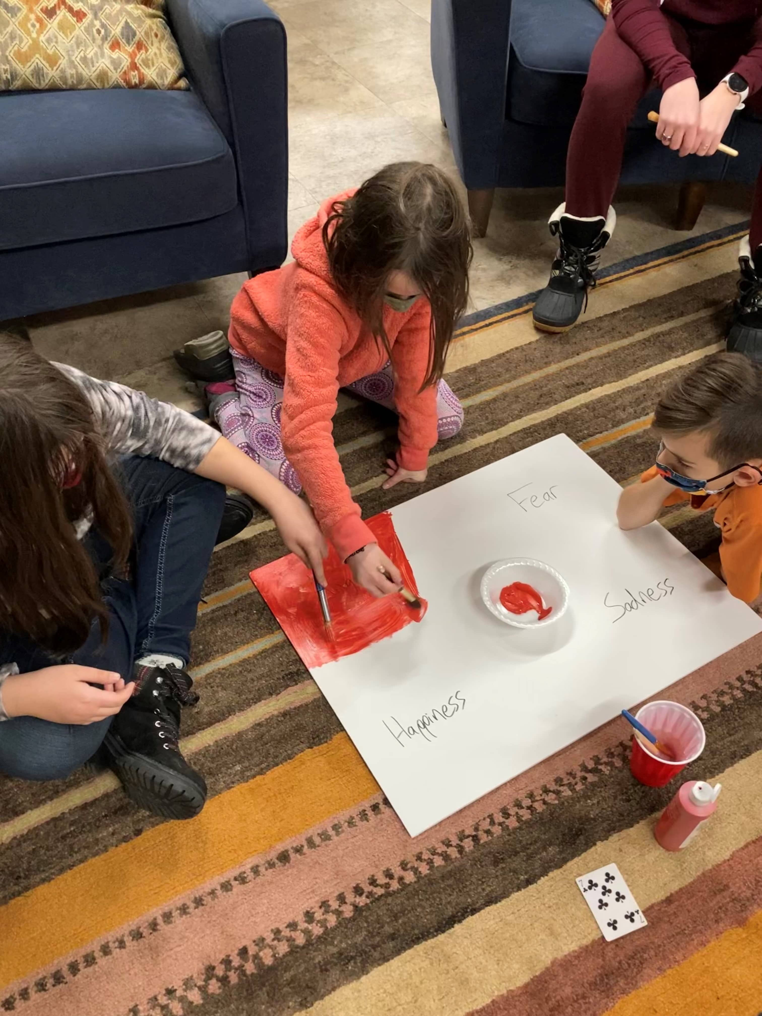 students painting poster on 2-9-22